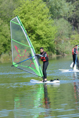 a man doing wind surfing