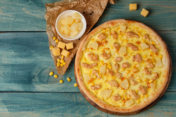 Tasty pizza with pineapple and chicken