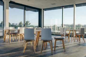 A dining room table in front of a window