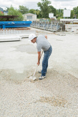 worker with safety helmet outside a factory