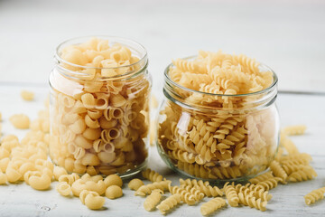 Two kinds of Italian whole wheat pasta in glass jars