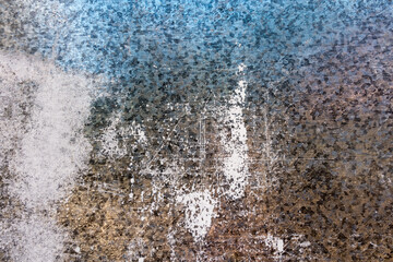 Old grunge vintage background: rusty metal surface with blue paint flaking and cracking texture