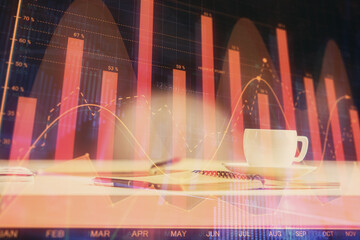 Multi exposure of forex graph drawing and desktop with coffee and items on table background. Concept of financial market trading
