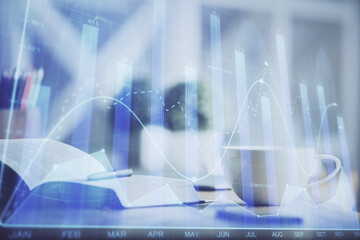 Multi exposure of forex graph drawing and desktop with coffee and items on table background. Concept of financial market trading