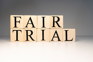 Fair trial word from wooden cubes. About law terms.