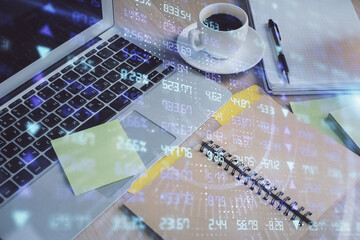 Multi exposure of forex graph drawing and desktop with coffee and items on table background. Concept of financial market trading
