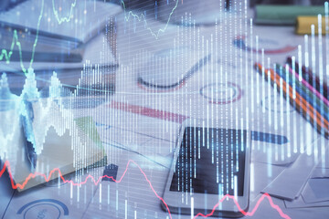 Obraz premium Double exposure of forex graph drawing and cell phone background. Concept of financial data analysis