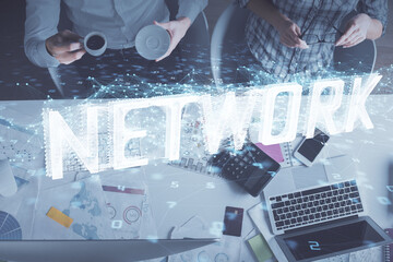 Double exposure of man and woman working together and data theme hologram drawing. Computer background. Top View.