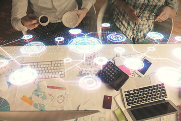 Double exposure of man and woman working together and social network theme hologram drawing. Computer background. connecting concept. Top View.