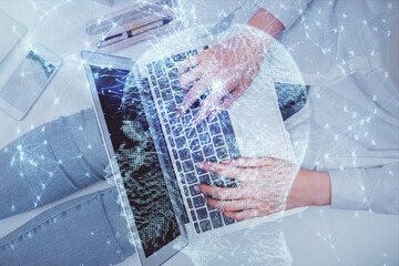 Double exposure of woman working on computer andhuman brain hologram drawing. Top View. Ai concept.