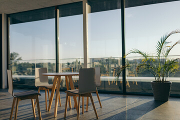 A dining room table in front of a window