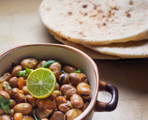Ful Medames - Dish of Egyptian fava beans with lemon ,cumin ,vegetable - obrazy, fototapety, plakaty