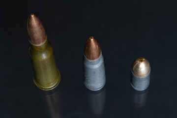 A Group of Three Military Cartridges (7.62x54r, 7.62x39, 9mm) © Cavan