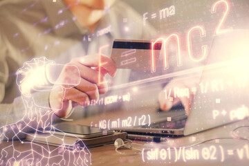 Double exposure of man hands holding a credit card and formula drawing. Education and E-commerce...