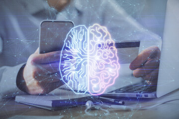 Double exposure of man hands typing on computer with credit card and brain theme drawing....