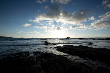 A landscape view of Broad Haven beach at dusk and sunset in Broad Haven, Pembrokeshire, Wales, UK....