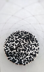 melted instant coffee grains bottom of a paper glass 