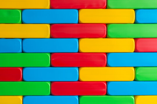 Large Blocks For Kids Education. Brick Wall Made Of Huge Lightweight Plastic Building Blocks. Brick Toys For Kindergarden Play