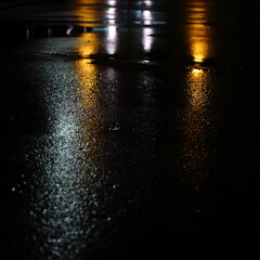 Lit concrete in the rain