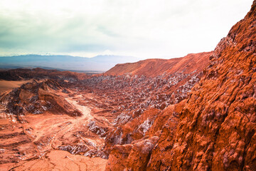 Fototapeta na wymiar landscape of death valley / mars valley with red rock range and white salt layer and clouds #3