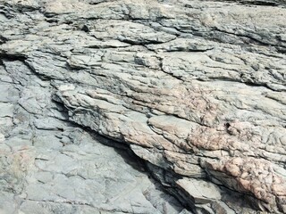Cracked white rock with shadows