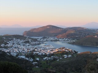 View of the port on Patmos, Greece with the sunset and ocean in the background
