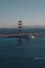 golden gate bridge san francisco with lines of boats in the ocean