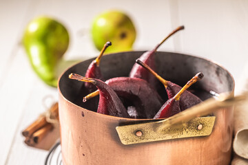 Closeup of tasty mulled wine with pears on white table