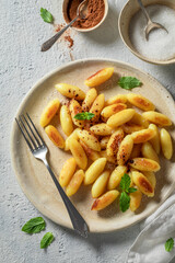 Enjoy your potato dumplings fried in pan with butter