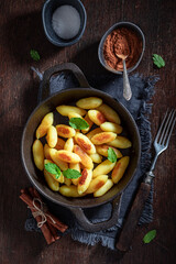 Homemade potato dumplings with cinnamon, sugar and mint leaves