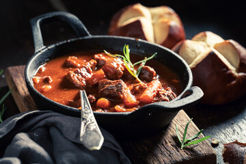 Tasty goulash served with fresh hot buns