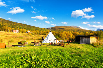 Bardu wooden architecture heritage park. Antique buildings, agricultural machines and tipi © Milosz Maslanka