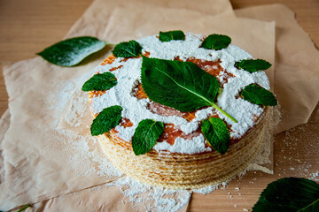 cooking waffle cake, step by step, with boiled condensed milk, and garnished with fresh mint leaves