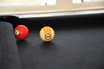 Black billiard table, Billiard balls in a pool table, focused on 9 ball