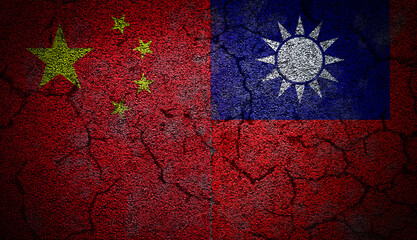 Grunge dual flags of China and Taiwan on concrete wall with cracks to illustrate the tension and conflict between the two.