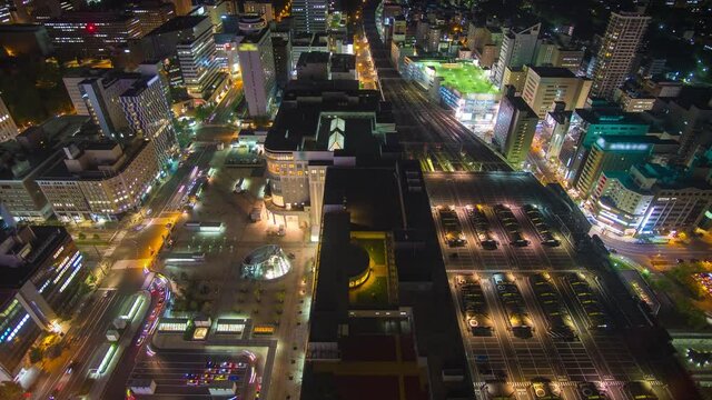 Time-lapse of high view of Sapporo financial district city at night with car light trail, Sapporo city is the biggest city in Hokkaido Japan