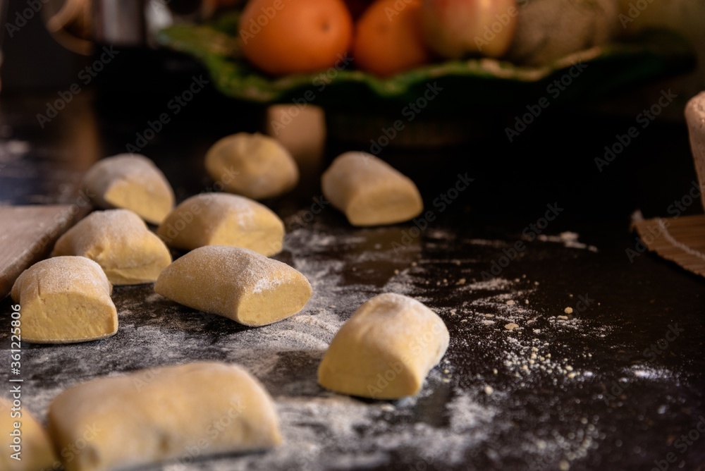 Sticker closeup shot of dough with flour on a chopping board made for meat dumplings