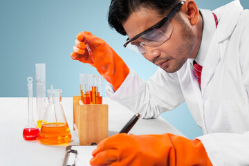 Male scientist doing an experiment in the studio