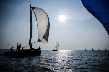 Sailing yacht race. Ship yachts with white sails in the open Sea. Luxury boats