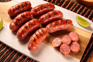 Fresh grilled Pepperoni sausage. Grilled Pepperoni Sausage on wooden board. 