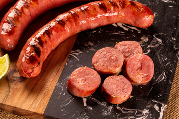 Fresh grilled Pepperoni sausage. Grilled Pepperoni Sausage on wooden board. 