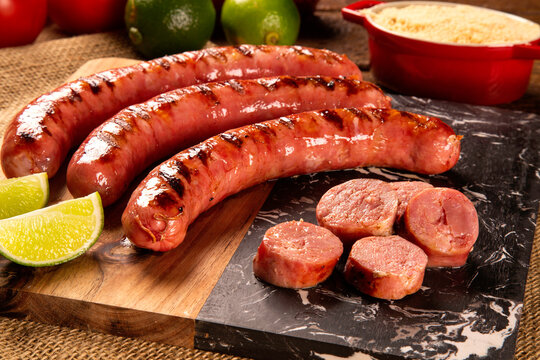 Fresh grilled Pepperoni sausage. Grilled Pepperoni Sausage on wooden board. 