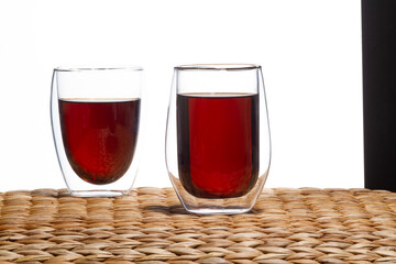 red tea in glass cup