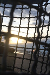 sunset behind grid