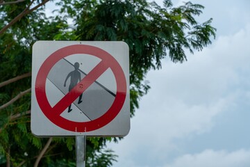 Road sign prohibiting pedestrians to cross the road