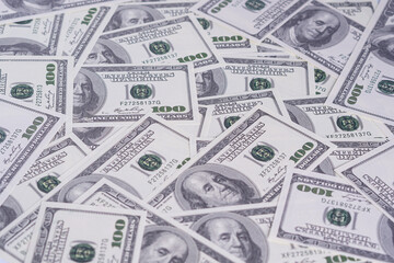 Top view pile of one hundred dollars as background. Texture US dollars.