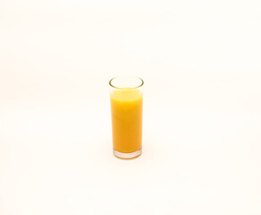 Delicious freshly squeezed fruit juice isolated against a white background 