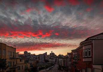 High angle view of homes on the famous crooked Lombard Street, San Francisco California with fiery skies at sunset