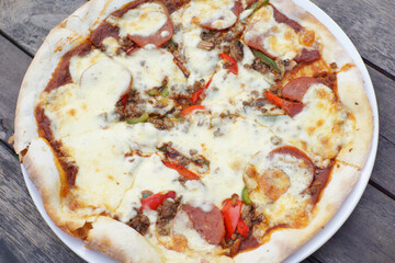 Close up of mediterranian pizza with meat topping.