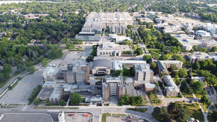 Aerial View of a College Campus in the Summertime with Dense Buildings during Summer 